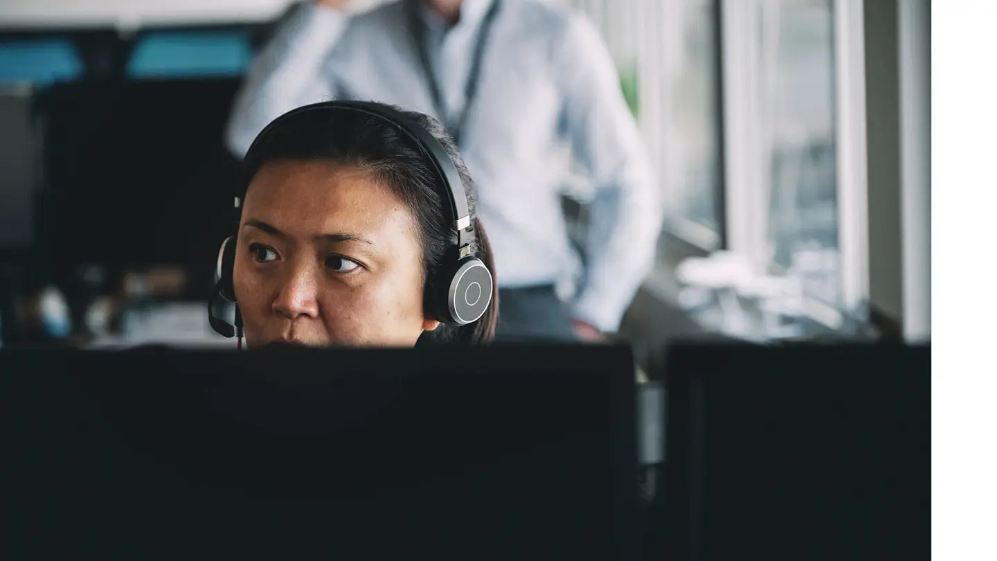 female satair customer support employee seen above screen